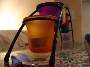 An arched candle holder in front of the sink
