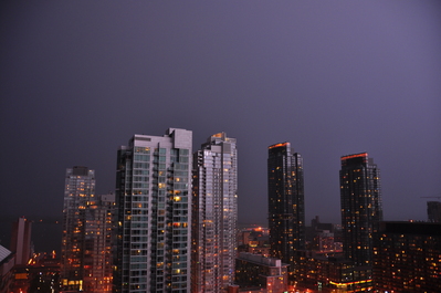 Lightning behind me illuminating the buildings