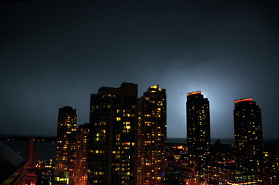 Lightning arcing behind the building