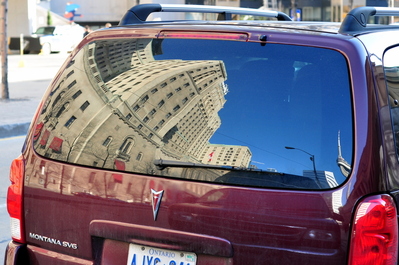 Reflection of the Royal York Hotel + CN Tower on a Montana