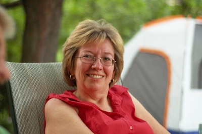 Mom sitting in the backyard in Ottawa after supper