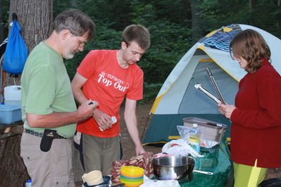 Preparing the steaks to go on the fire