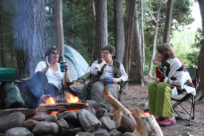 Judy, Pat and Laura chatting around the fire
