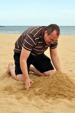 Patrick playing in the sand on the beach, intense!