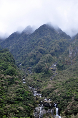 Rocks and mountains and waterfalls and clouds
