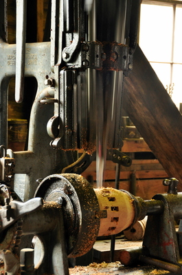 Steam engine powered chisel making the centre drum for a new wheel