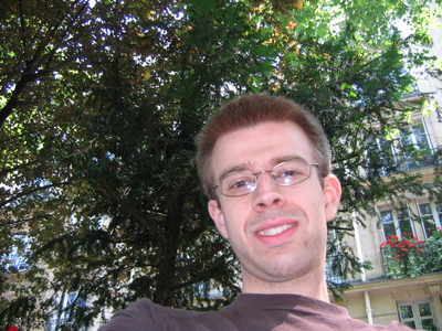 Me in front of the pretty buildings and trees