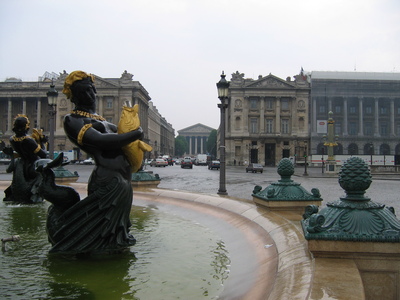 Close up of the fountain with the church of Saint Madeleine in the distance