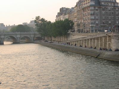 People chilling along the river