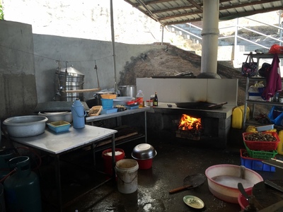 Kitchen area with wood stove at lunch restaurant