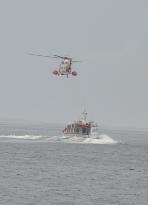 The helicopter dropped that guy on that boat while we were on the ferry, I never found out why