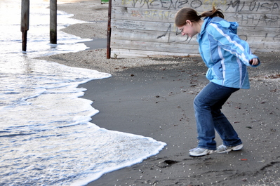 Kim dodging the waves