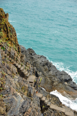 Stairs down to a fishing spot by the water