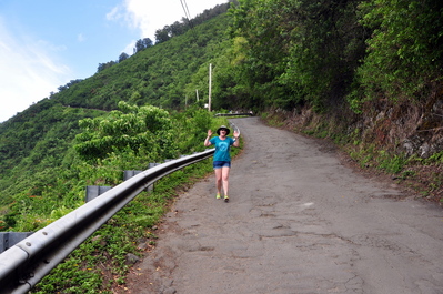 Sarah running down the road into the valley