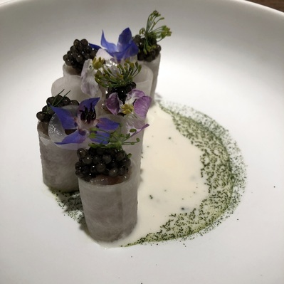 Daikon rolls filled with shima-aji (fish and fish eggs) with cheese sauce