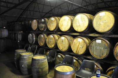 Casks in the warehouse, and the plastic bottle that ended up holding the special treat for Lee