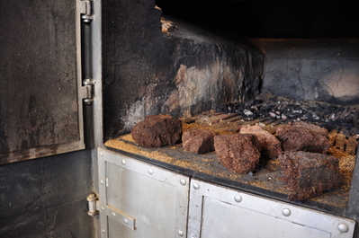 Oven under the kiln with some peat