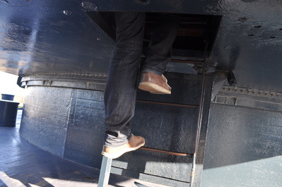 Me climbing up into one of the big guns