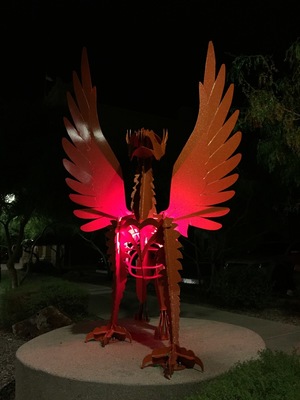 Street art in Tucson, there were gryphon tracks carved into the sidewalk behind it (front feet eagle and back feet lion)