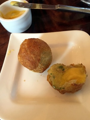 Delicious fried jalapeno cheddar biscuits with apricot honey butter